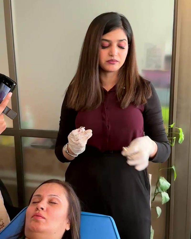 Mehak Ishtiaq explains the procedure to the class