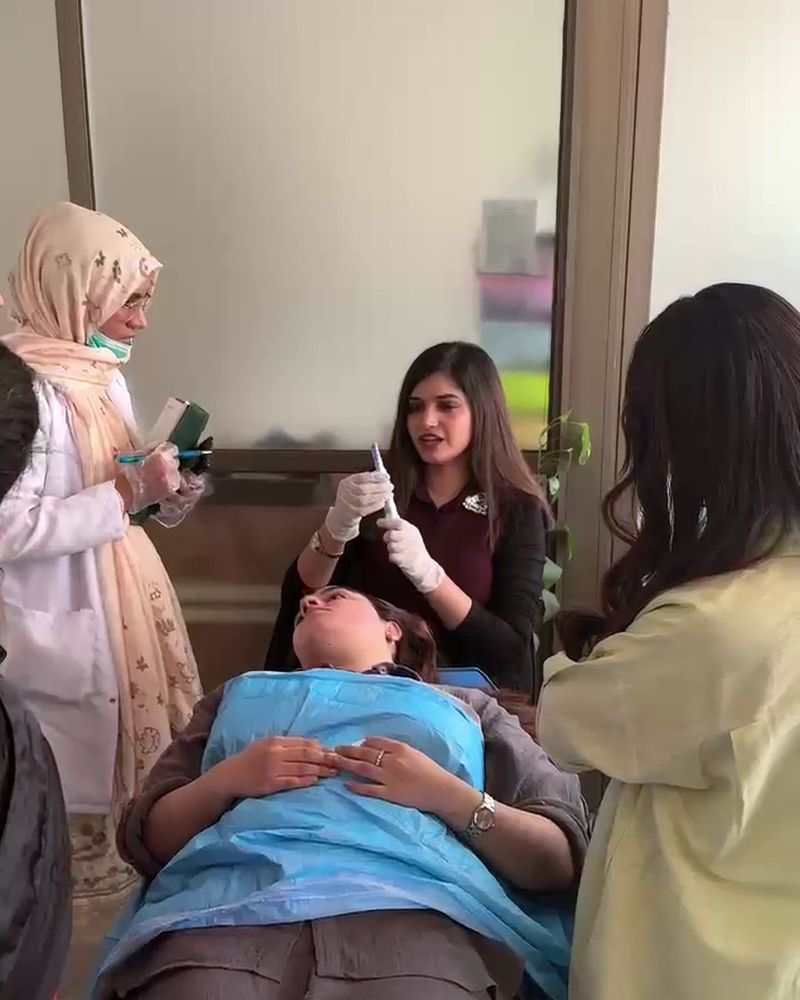 A group of participants in a hands-on aesthetics session